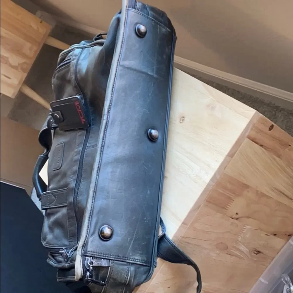 TUMI distressed leather messenger computer bag broken in rugged manly minimalist